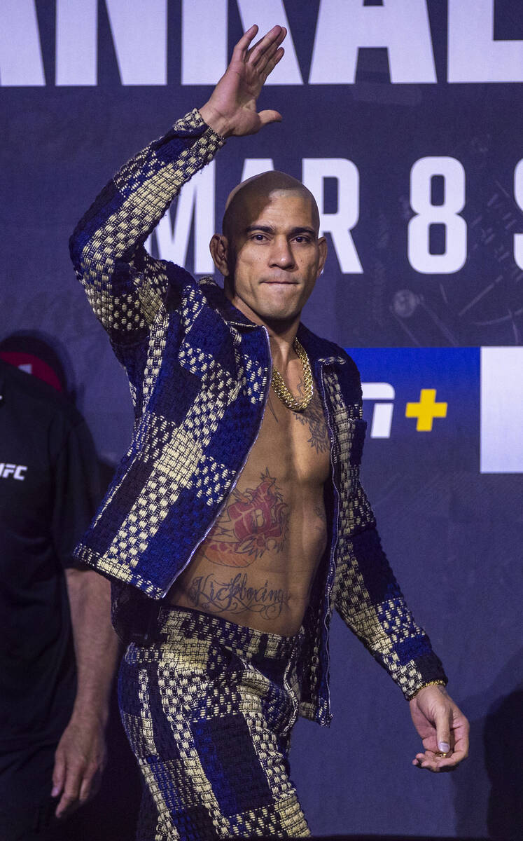 Light heavyweight fighter Alex Pereira arrives on stage during the UFC 313 press conference at ...