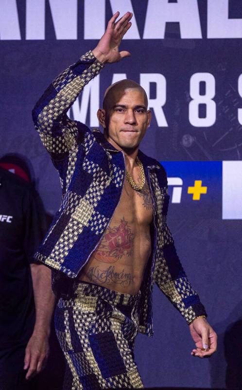 Light heavyweight fighter Alex Pereira arrives on stage during the UFC 313 press conference at ...
