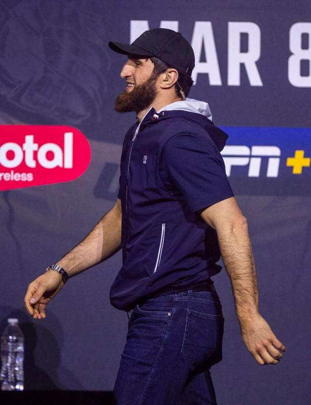 Light heavyweight fighter Magomed Ankalaev arrives on stage during the UFC 313 press conference ...