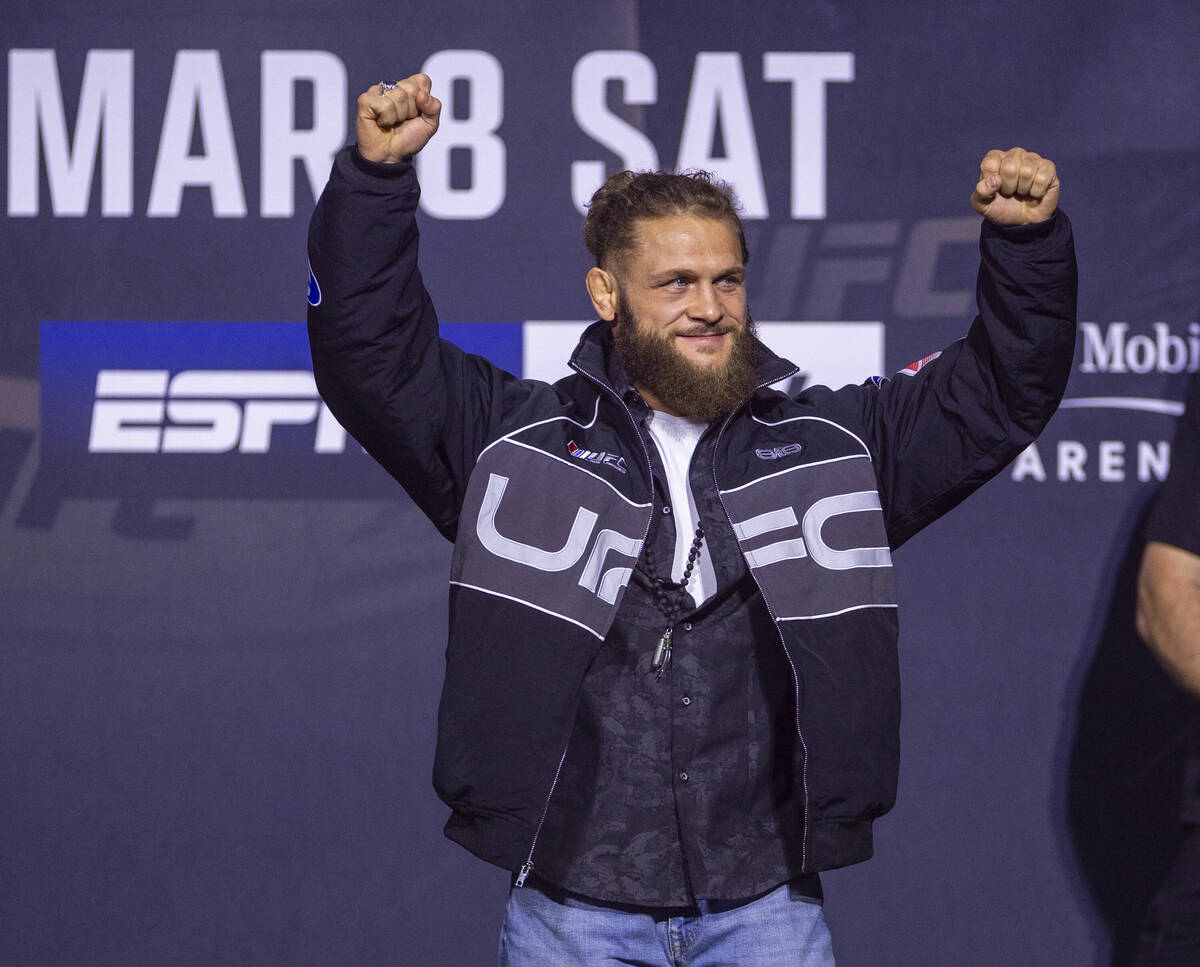 Lightweight fighter Rafael Fiziev arrives on stage during the UFC 313 press conference at the M ...