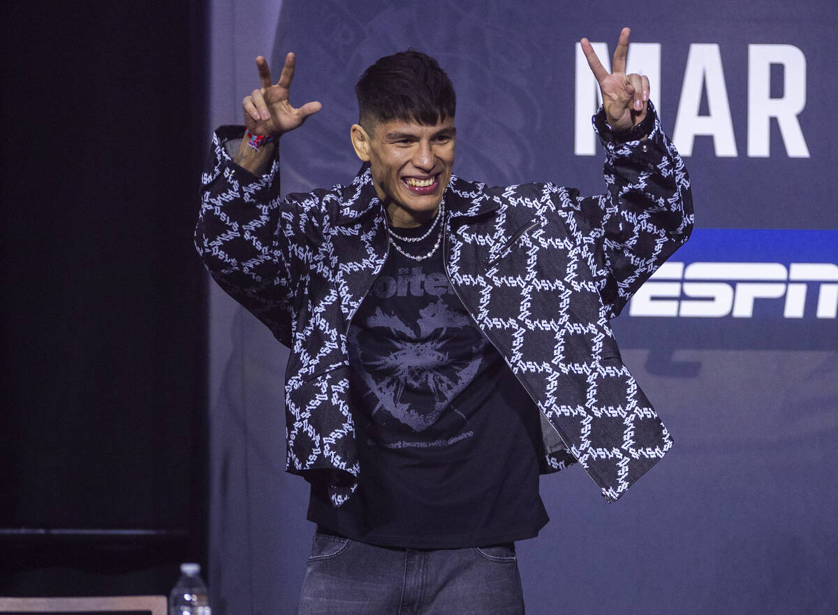 Lightweight fighter Ignacio Bahamondes arrives on stage during the UFC 313 press conference at ...
