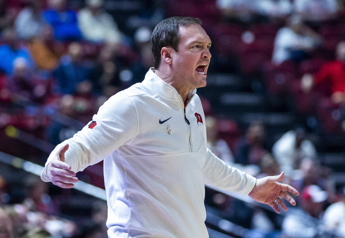 UNLV head coach Kevin Kruger is angry after a lack of foul calling by officials against the San ...