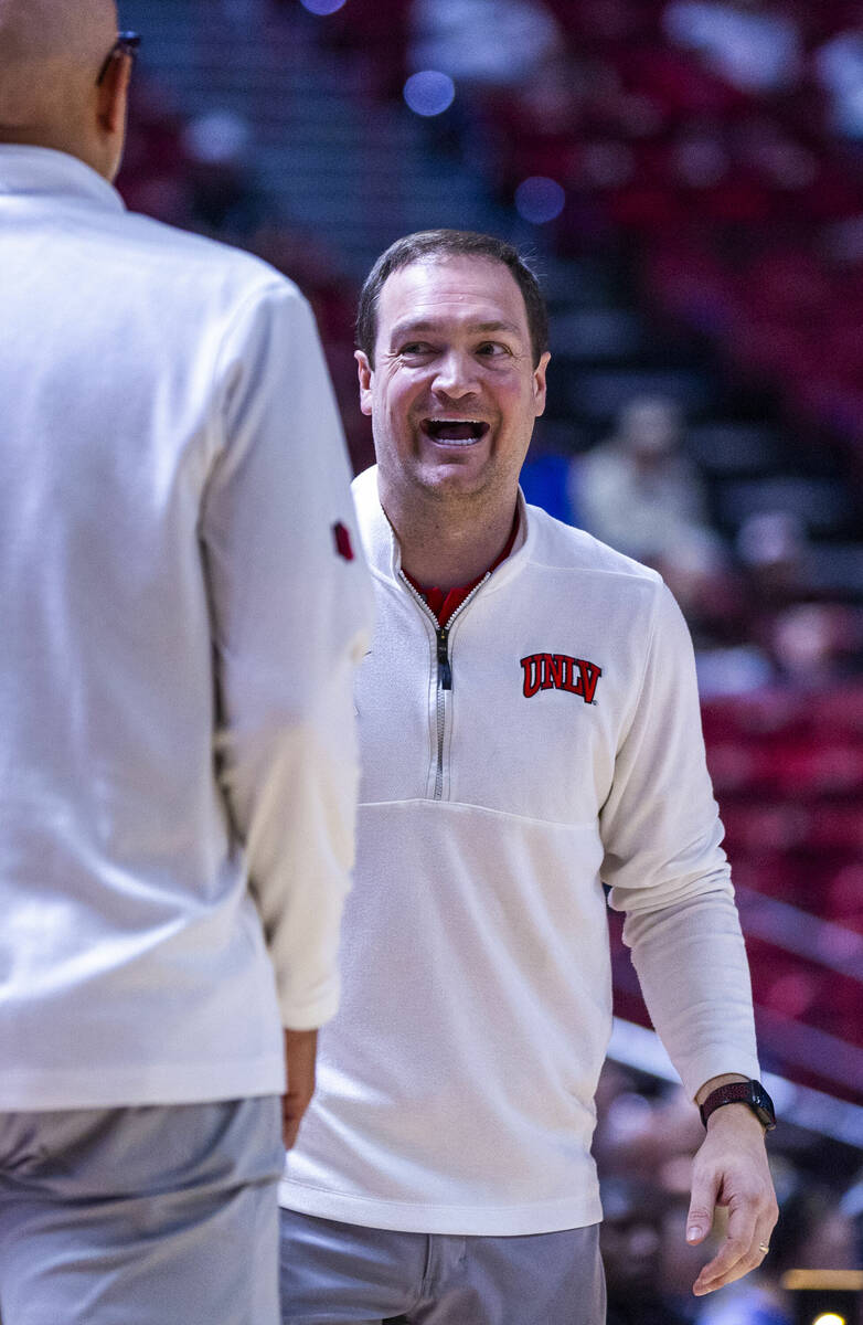 UNLV head coach Kevin Kruger is pleased as the game nears an end against the San Diego State Az ...