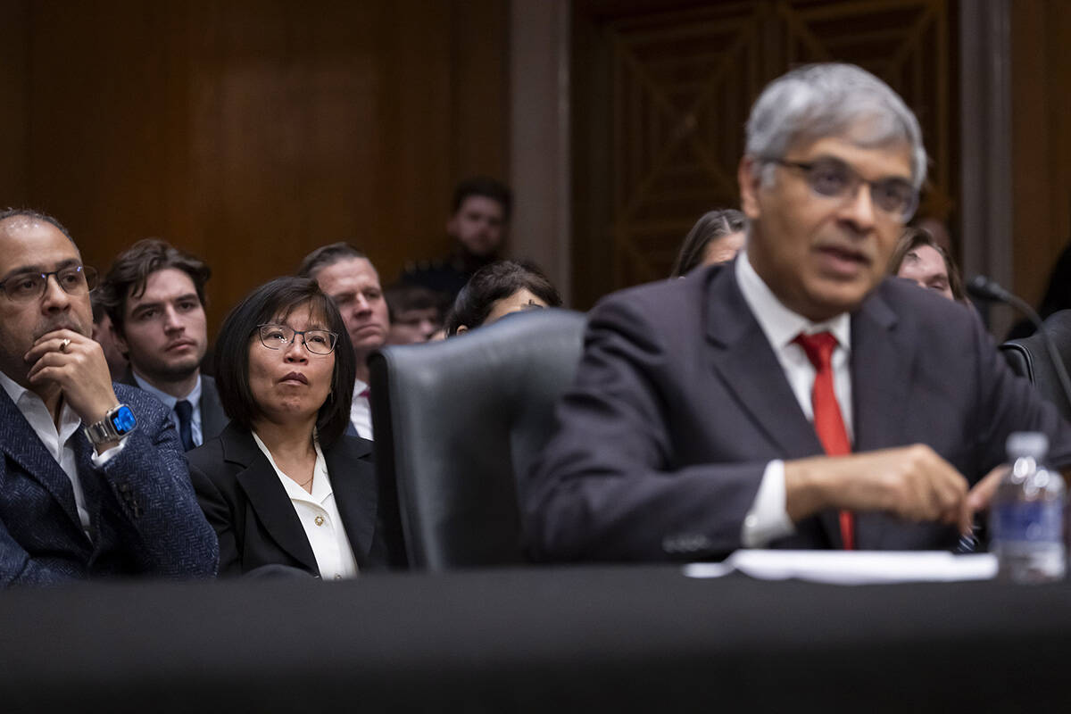 Catherine Su, center-left, the wife of Dr. Jay Bhattacharya, President Donald Trump's choice to ...