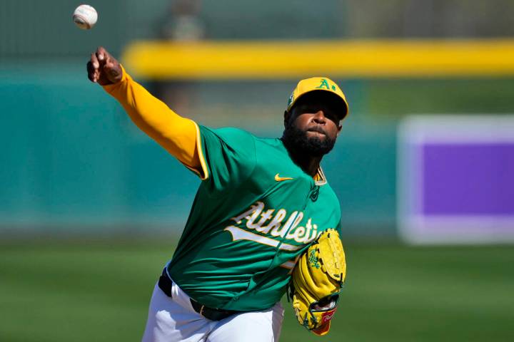 Athletics pitcher Luis Severino throws during the first inning of a spring training baseball ga ...