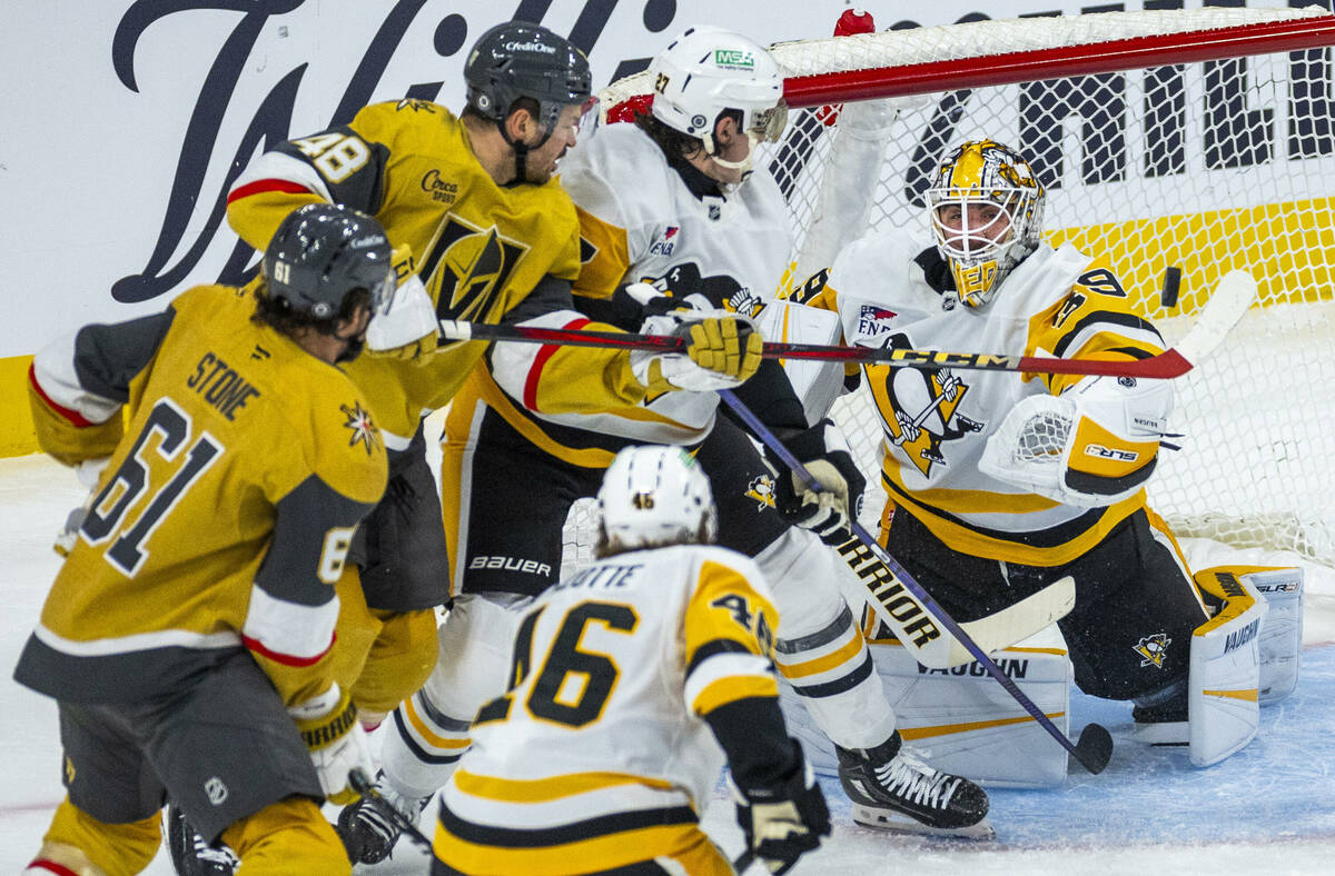 Golden Knights center Tomas Hertl (48) has a shot deflected by Pittsburgh Penguins goaltender A ...