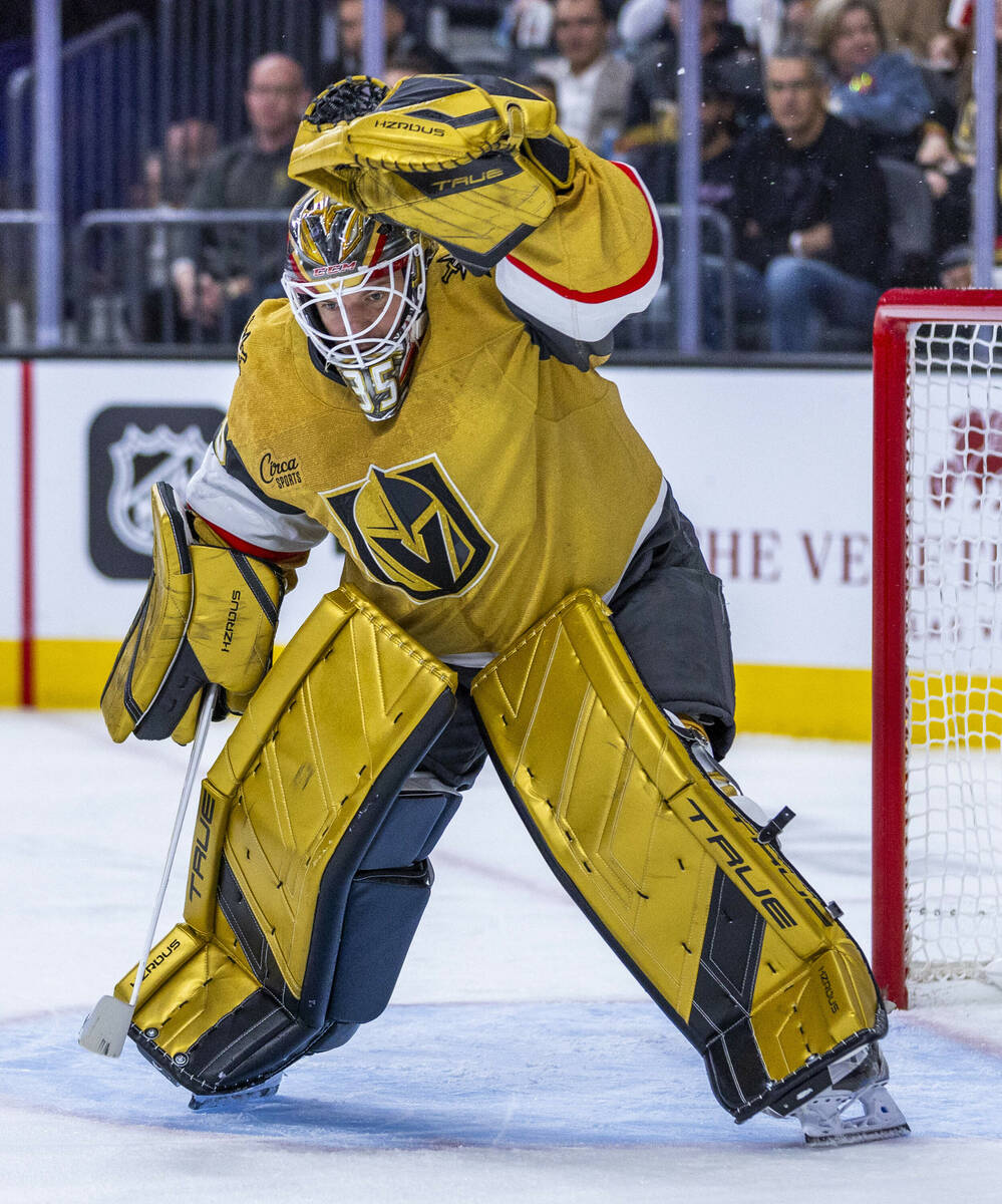 Golden Knights goaltender Ilya Samsonov (35) snatches a puck from the air against the Pittsburg ...
