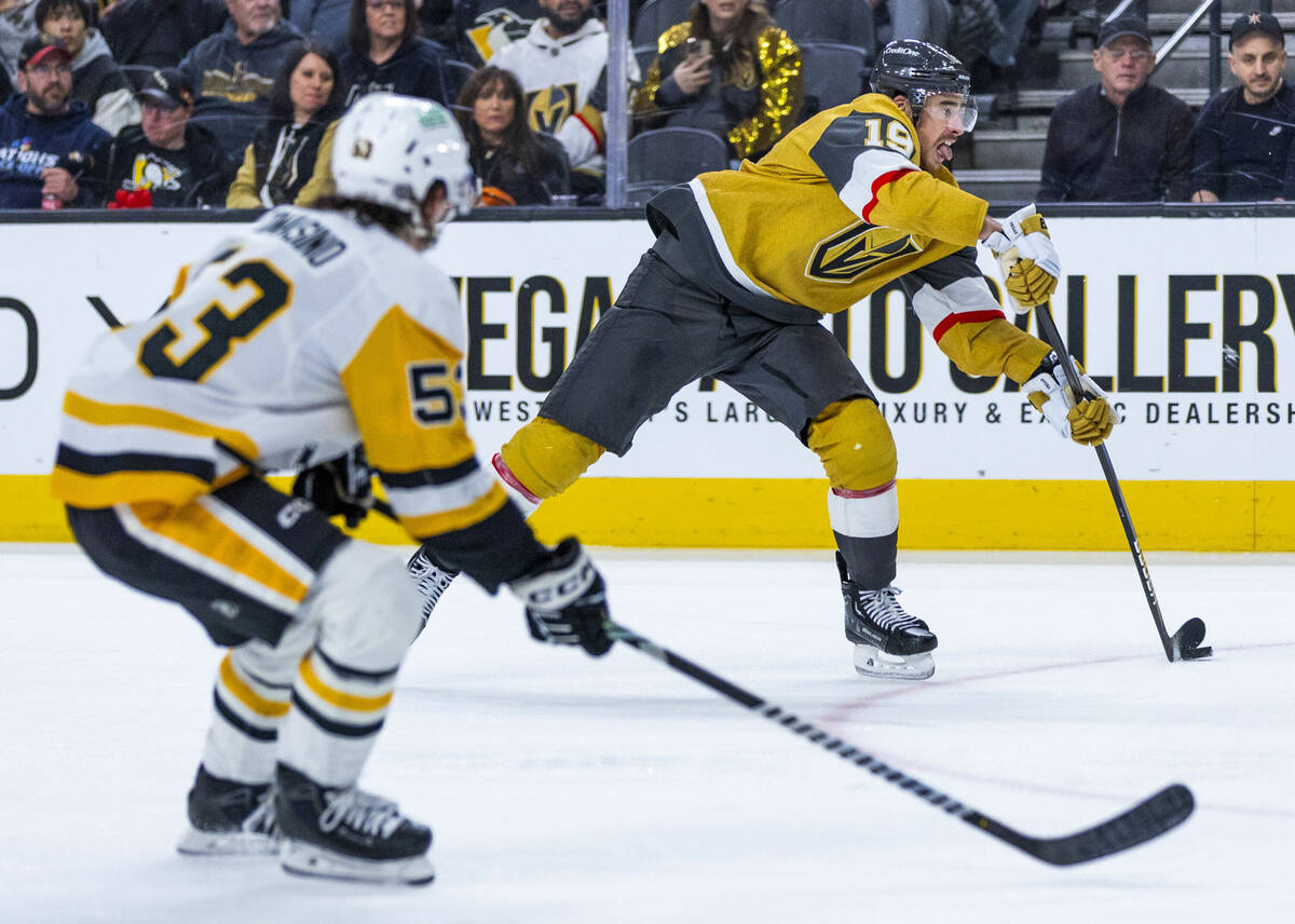 Golden Knights right wing Reilly Smith (19) looks to shoot with Pittsburgh Penguins center Phil ...
