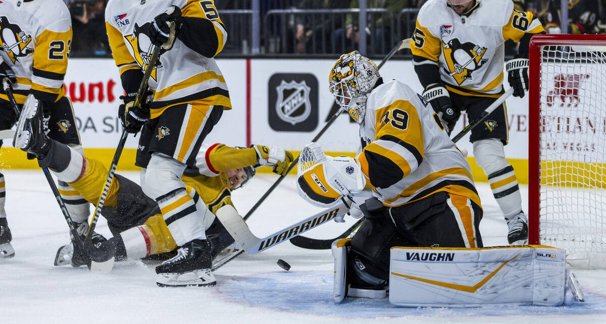 Pittsburgh Penguins goaltender Alex Nedeljkovic (39) looks to a puck as Golden Knights right wi ...
