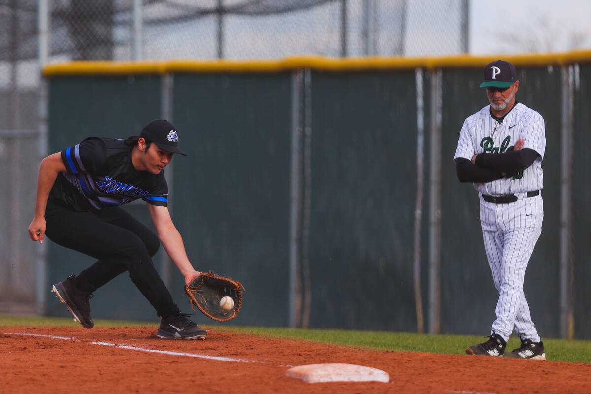 Basic first baseman Gabe Giron (11) scoops up the ball during a high school baseball game betwe ...