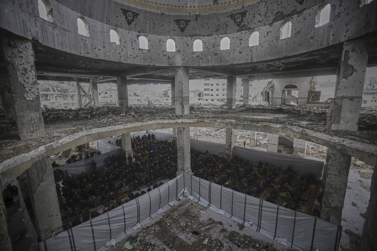 Palestinians pray during the first Friday prayers of the Muslim holy month of Ramadan at the Im ...