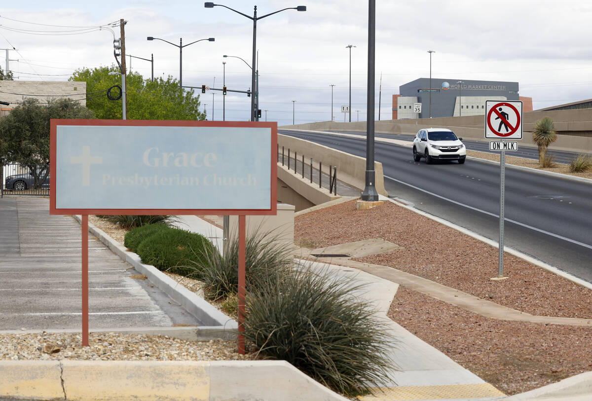 A motorist navigates on the elevated Martin Luther King Boulevard next to Grace Presbyterian Ch ...