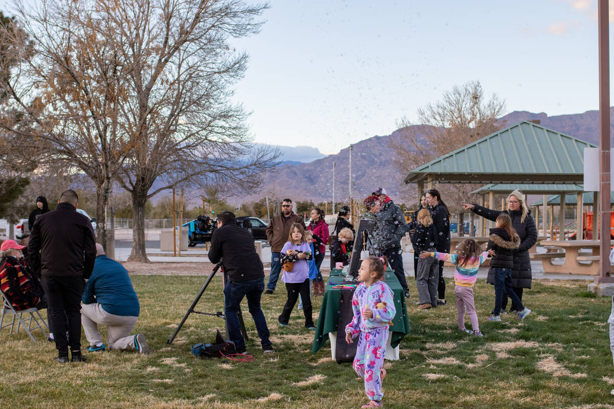 Friends and family of James “Jimmy” McCoy gather for a vigil and bubble release on Friday, ...
