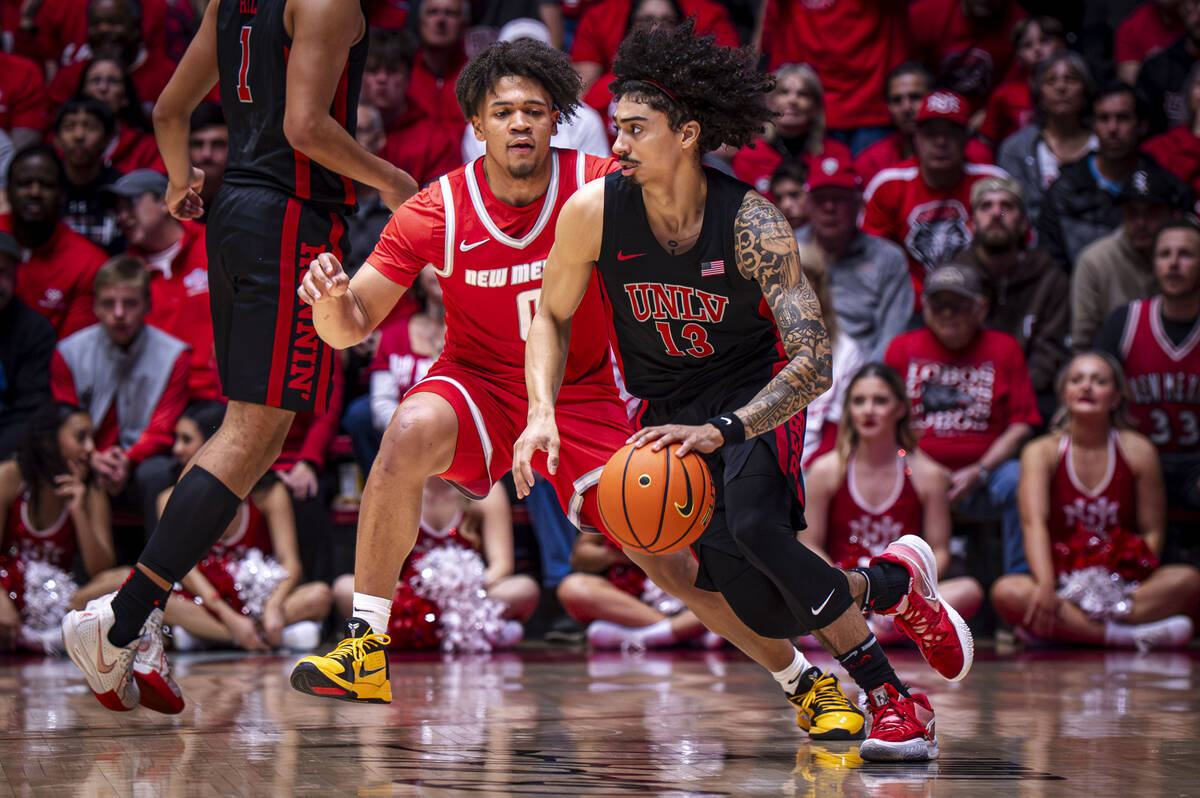 UNLV guard Brooklyn Hicks, right, looks for an opening while guarded by New Mexico guard CJ Nol ...
