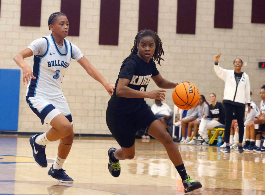 Democracy Prep's Keonni Lewis (0) drives past Centennial's D'Arrah Mitchell (3) during the firs ...