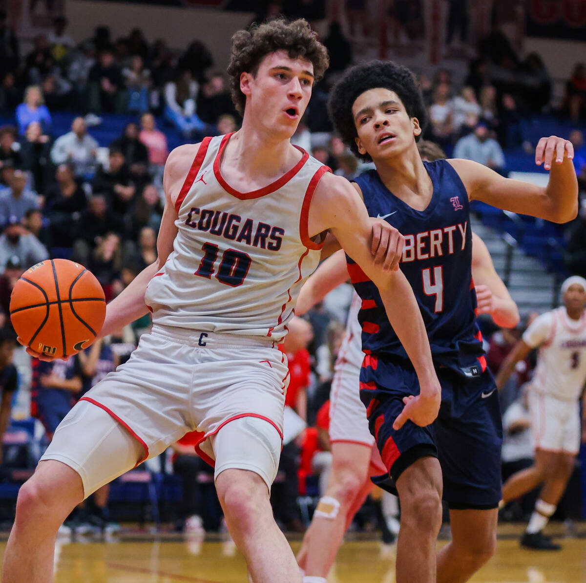 Coronado’s Mason Abittan (10) passes the ball to a teammate as Liberty shooting guard Ta ...