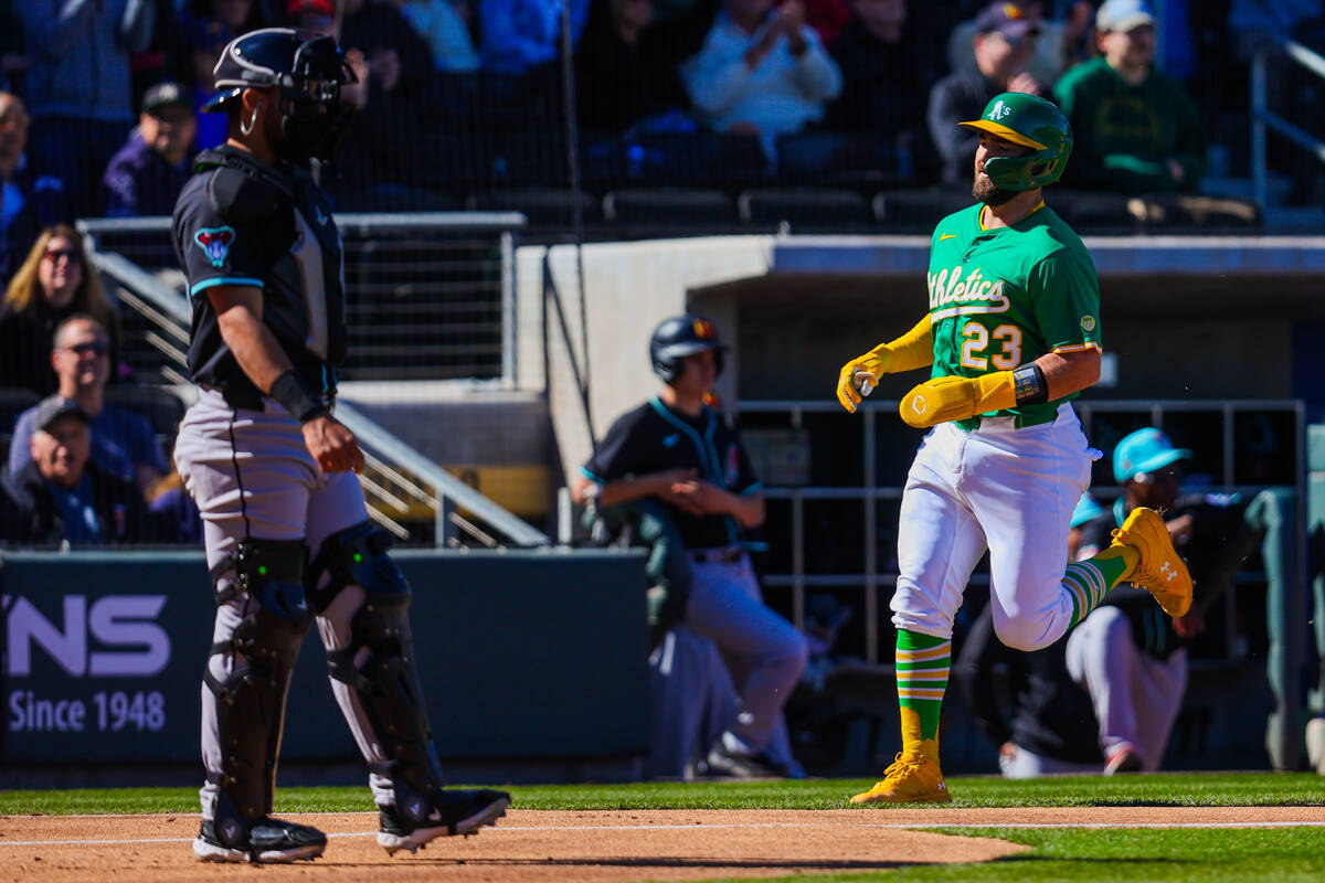 Athletics catcher Shea Langeliers (23) runs to home base during a Big League Weekend baseball g ...