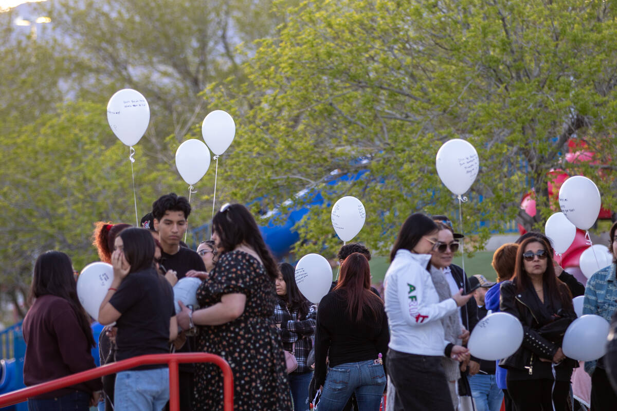 LAS VEGAS, NV - MARCH 8, 2025: Loved ones gather for a candle-lighting ceremony and balloon rel ...