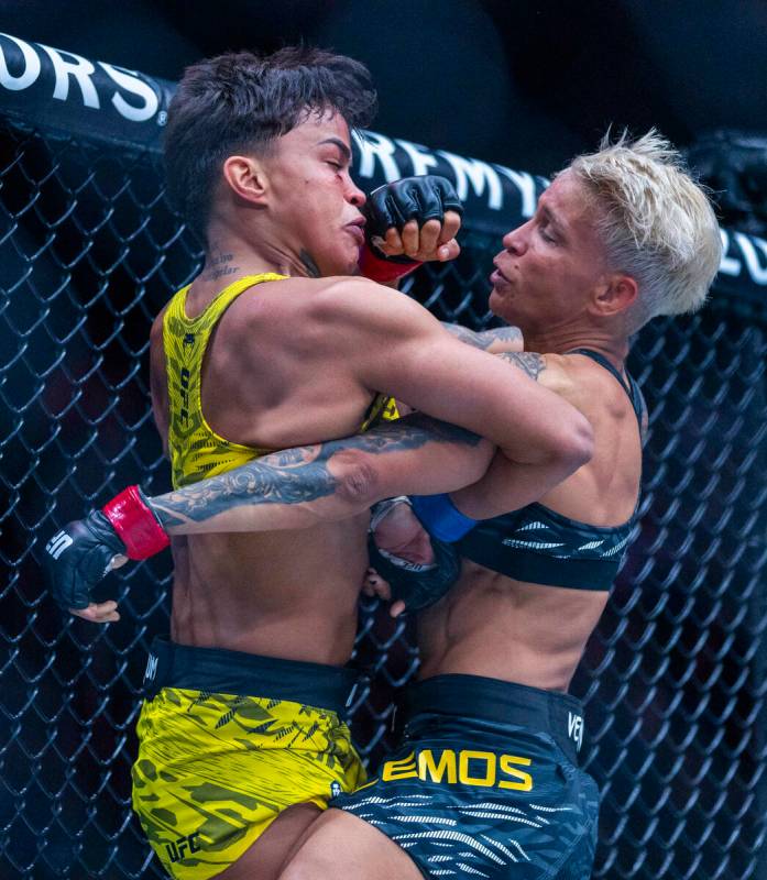 Amanda Lemos and lasmin Lucindo trade blows during their women’s strawweight fight at UF ...