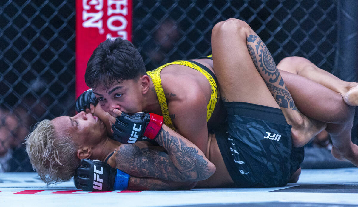 Iasmin Lucindo gets in the face3 of during their women’s strawweight fight at UFC 313 i ...