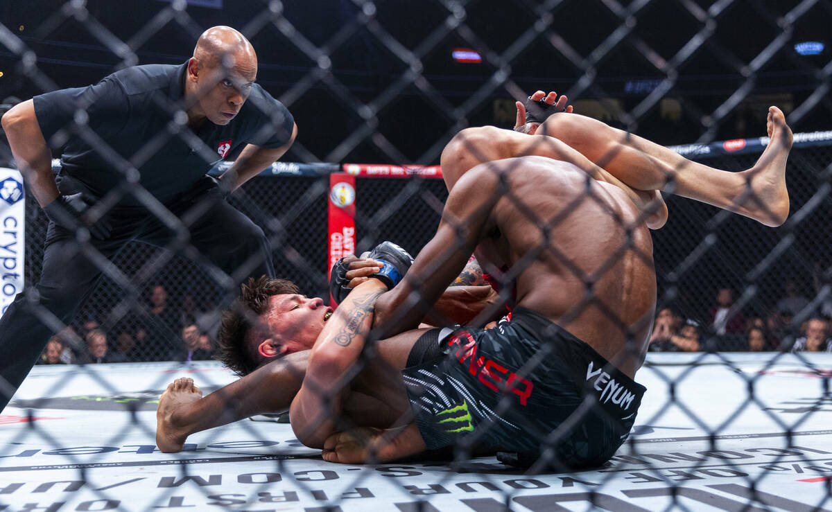 Ignacio Bahamondes keeps an arm bar on Jalin Turner for the win during their lightweight fight ...