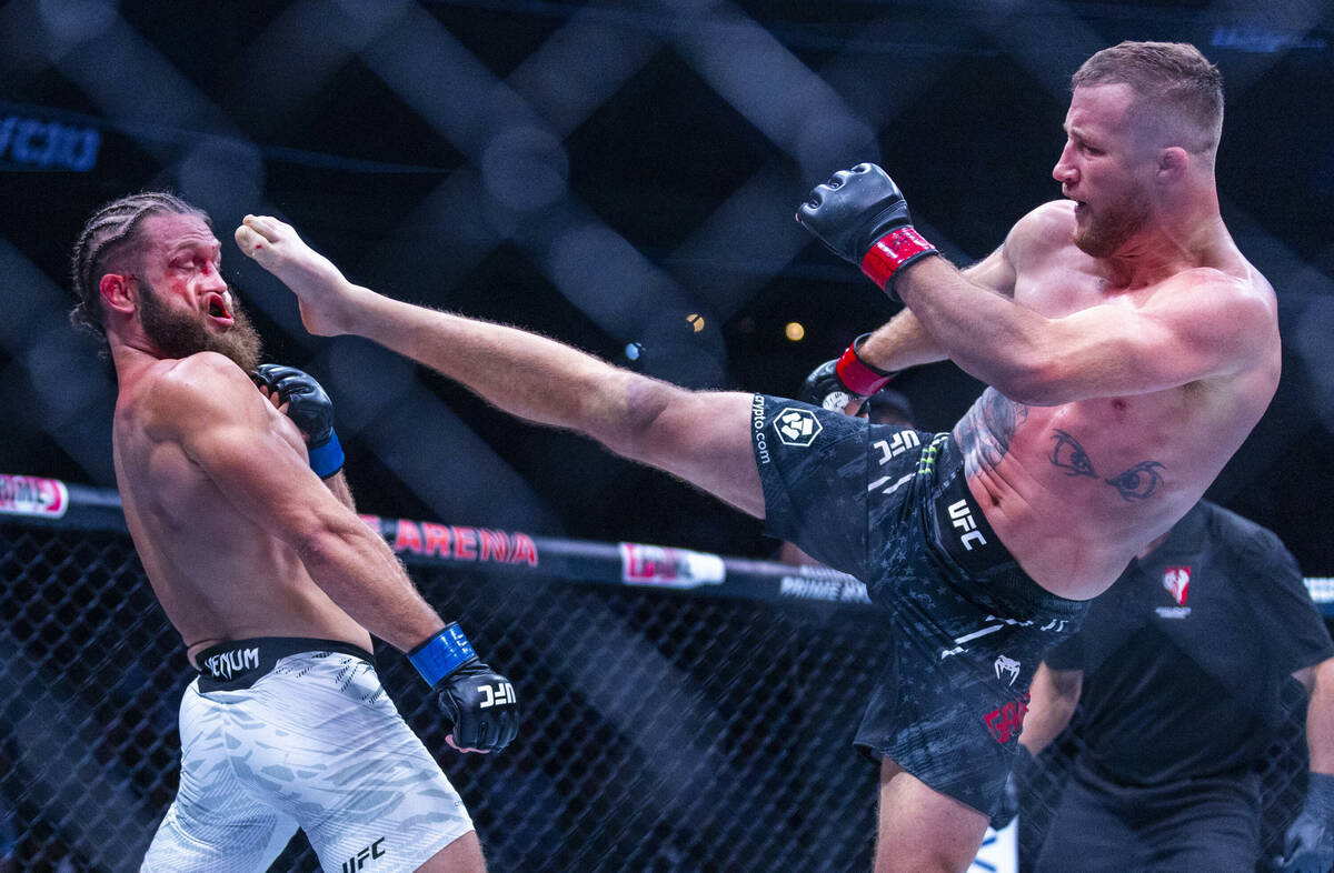 Rafael Fiziev takes a kick to the face from Justin Gaethje during their lightweight fight at UF ...