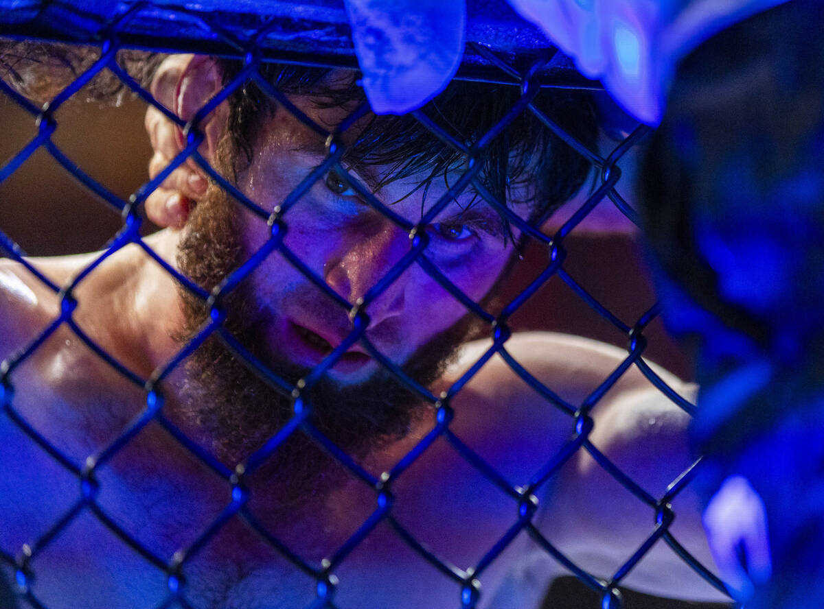 Magomed Ankalaev is spent with his team after battling Alex Pereira in their light heavyweight ...