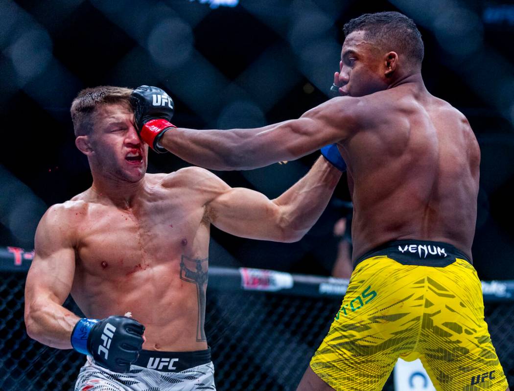 Francis Marshall takes a glove to the eye from Mairon Santos during their featherweight fight i ...
