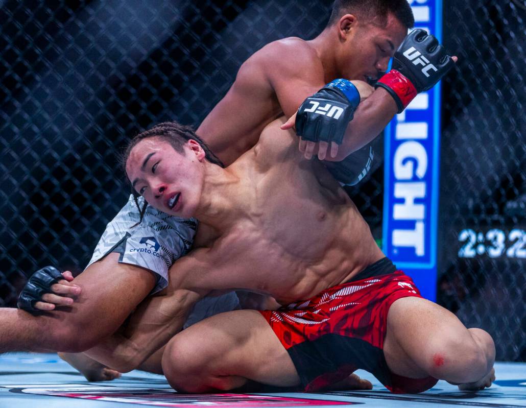 Rei Tsuruya attempts to flips over xJoshua Van during their flyweight fight in UFC 313 at the T ...