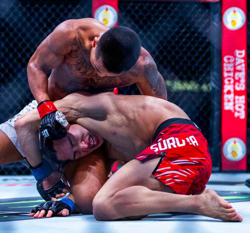 Joshua Van punches Rei Tsuruya in the face during their flyweight fight in UFC 313 at the T-Mob ...