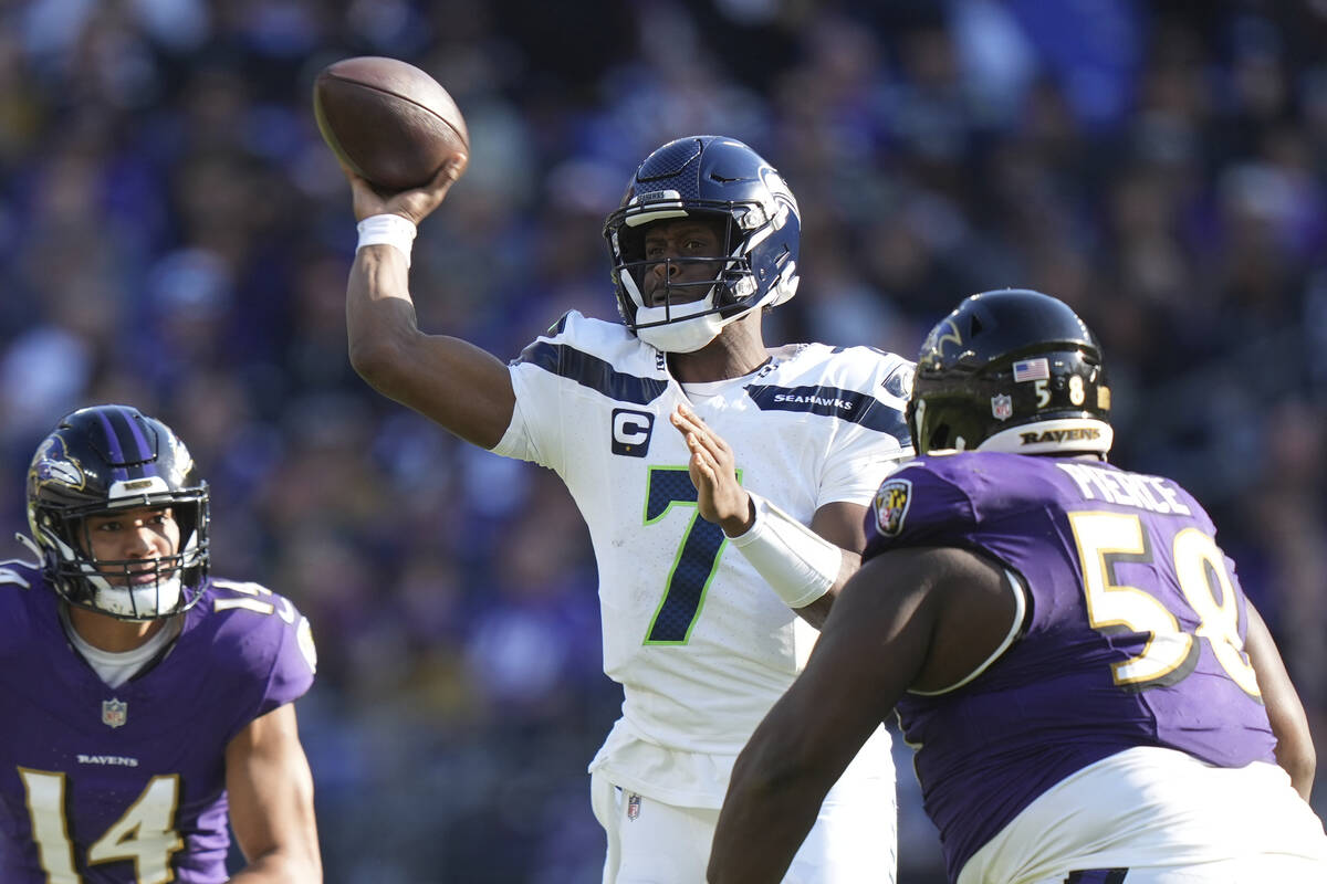 Seattle Seahawks quarterback Geno Smith (7) makes a pass attempt under pressure during an NFL f ...