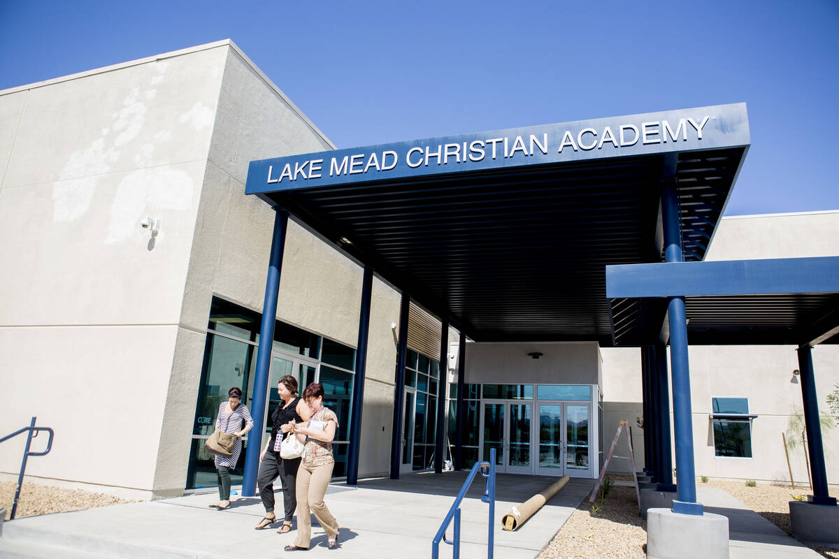 People exit Lake Mead Christian Academy's expanded campus entrance in August 2016 in Henderson. ...