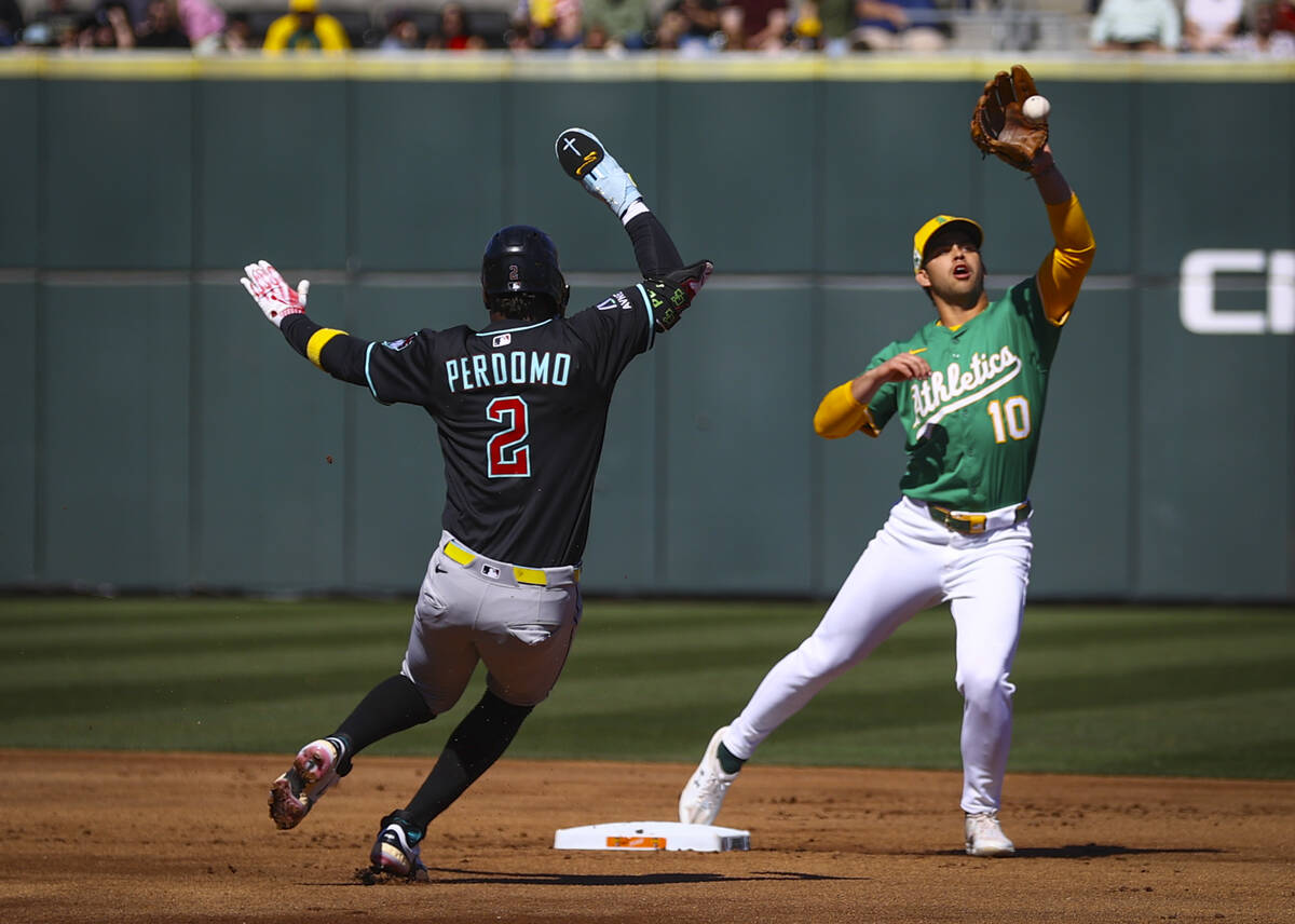 Arizona Diamondbacks’ Druw Jones (2) gets tagged out by Athletics’ Max Muncy duri ...