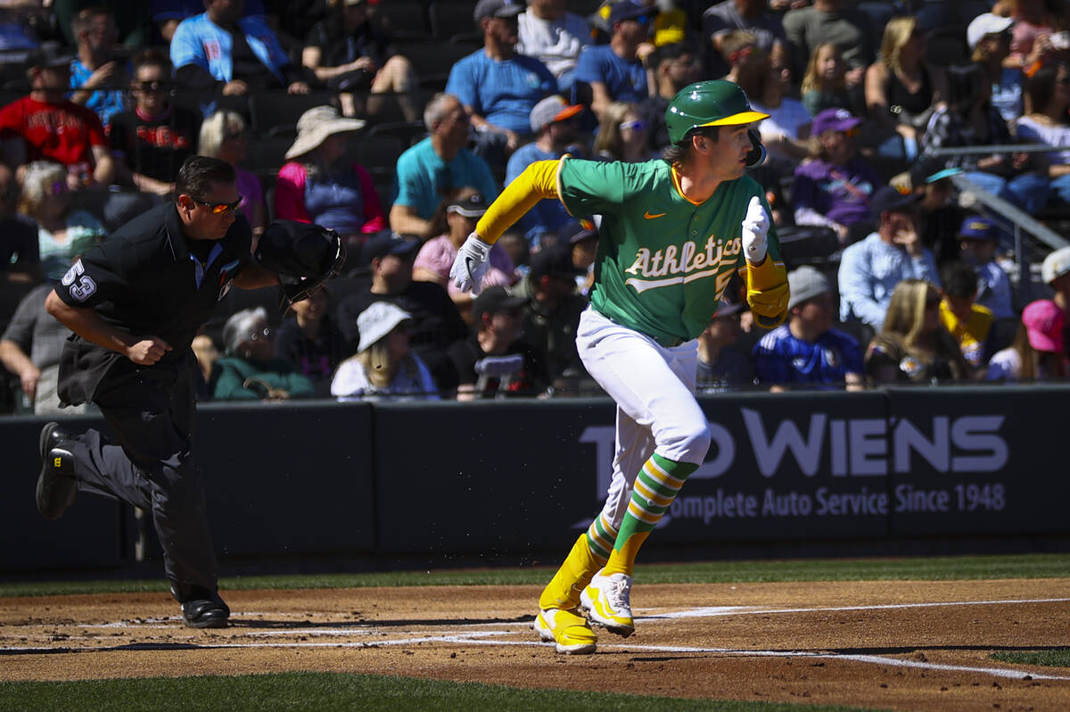 Athletics shortstop Jacob Wilson (5) runs to first base against the Arizona Diamondbacks during ...