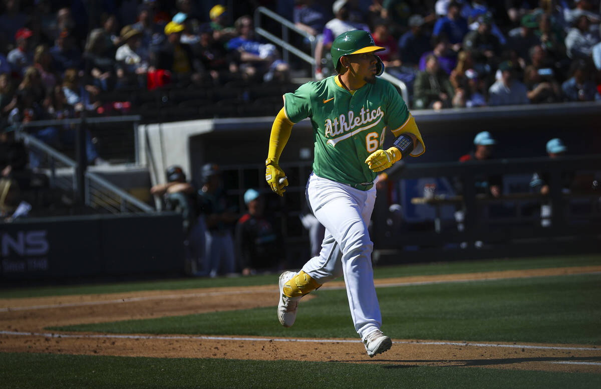 Athletics catcher Jhonny Pereda (64) rounds the bases on a home run against the Arizona Diamond ...