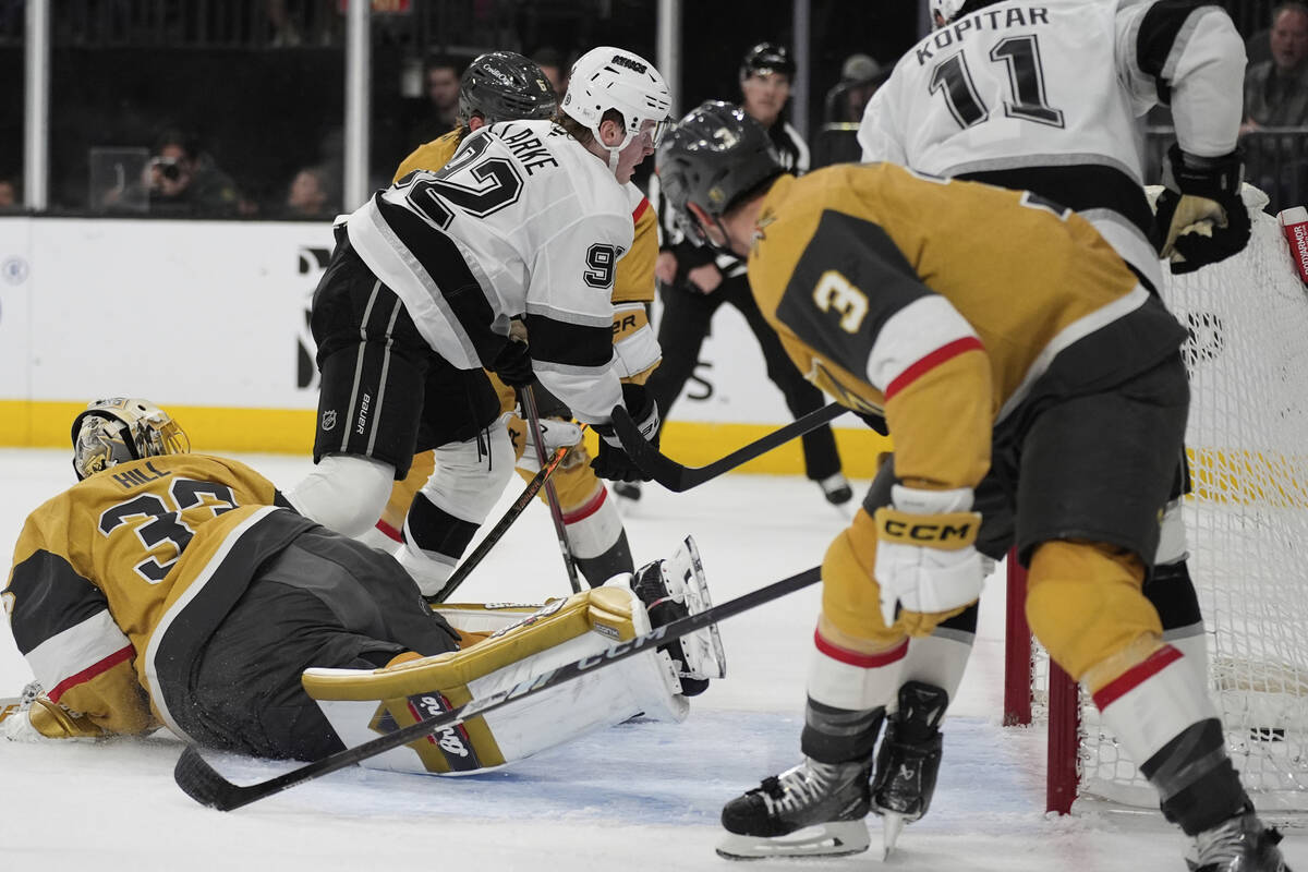 Los Angeles Kings defenseman Brandt Clarke (92) scores against Vegas Golden Knights goaltender ...