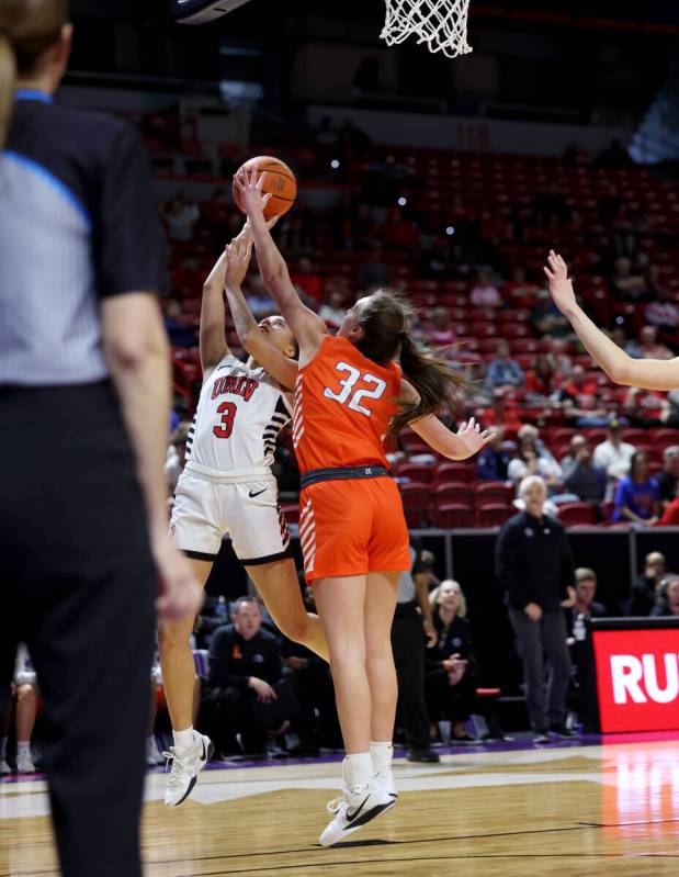 UNLV Lady Rebels guard Kiara Jackson (3) shoots over Boise State Broncos guard Natalie Pasco (3 ...