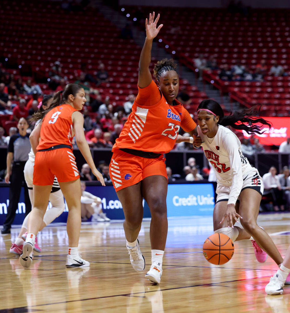 UNLV Lady Rebels forward Meadow Roland (32) drives against in the Boise State Broncos forward E ...