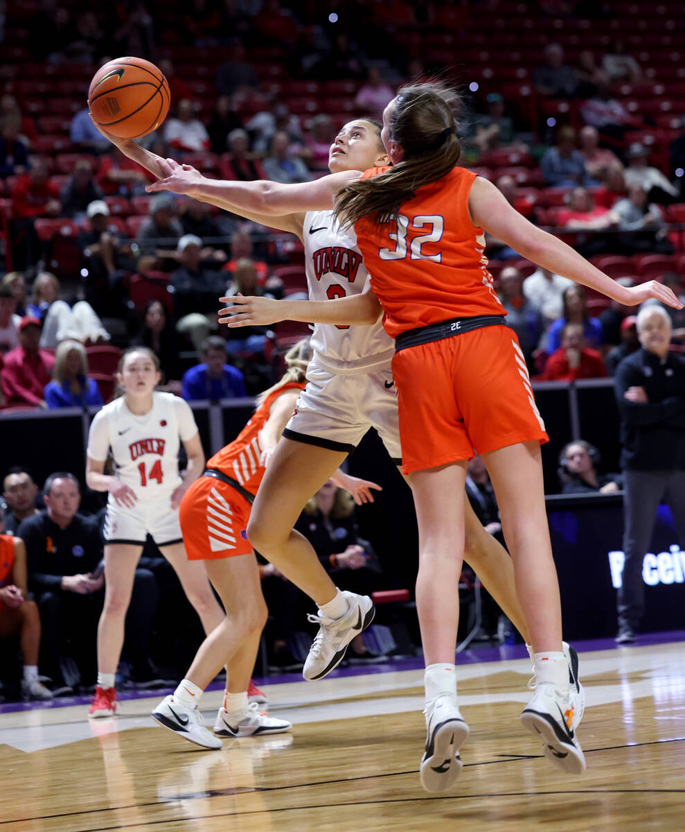 UNLV Lady Rebels guard Kiara Jackson (3) shoots past Boise State Broncos guard Natalie Pasco (3 ...