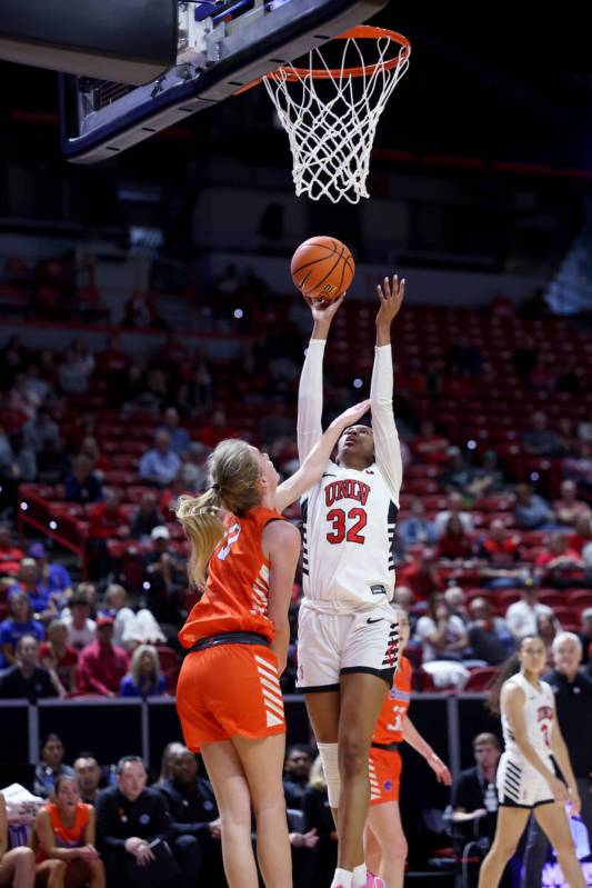 UNLV Lady Rebels forward Meadow Roland (32) shoots over Boise State Broncos guard Tatum Thompso ...