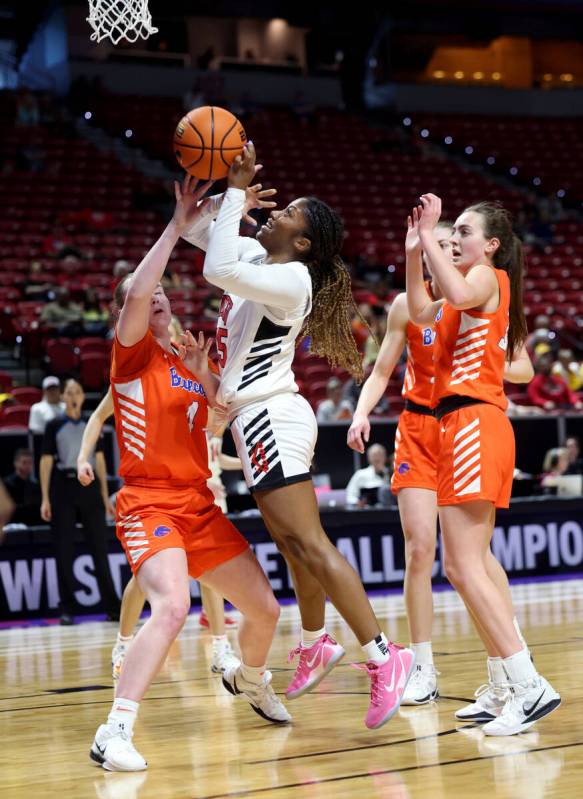 UNLV Lady Rebels guard Aaliyah Alexander (25) shoots over Boise State Broncos guard Dani Bayes ...
