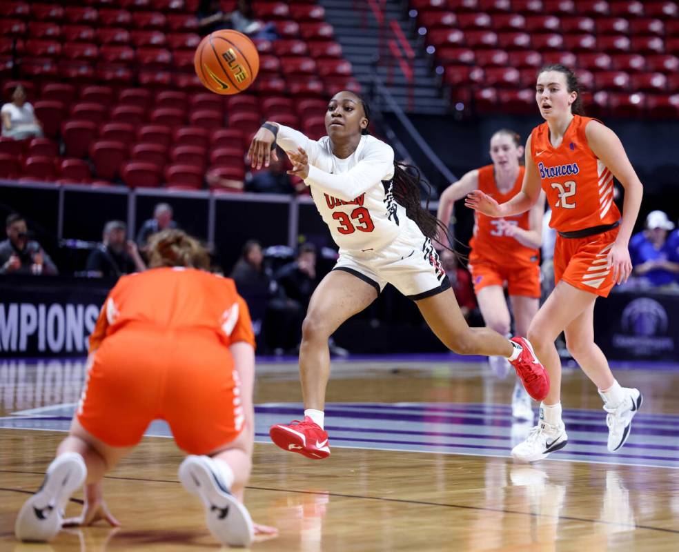UNLV Lady Rebels guard Amarachi Kimpson (33) passes the ball in front of Boise State Broncos gu ...