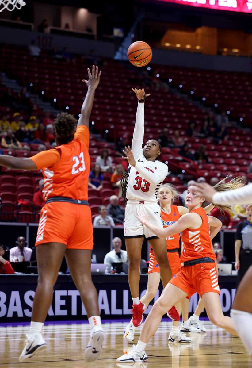 UNLV Lady Rebels guard Amarachi Kimpson (33) shoots over Boise State Broncos forward Elodie Lal ...