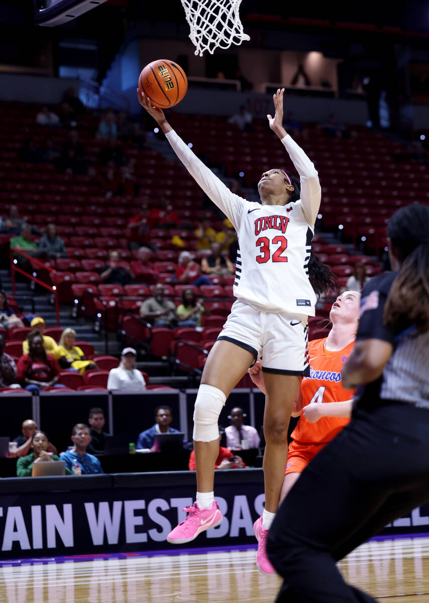 UNLV Lady Rebels forward Meadow Roland (32) shoots in front of Boise State Broncos guard Dani B ...
