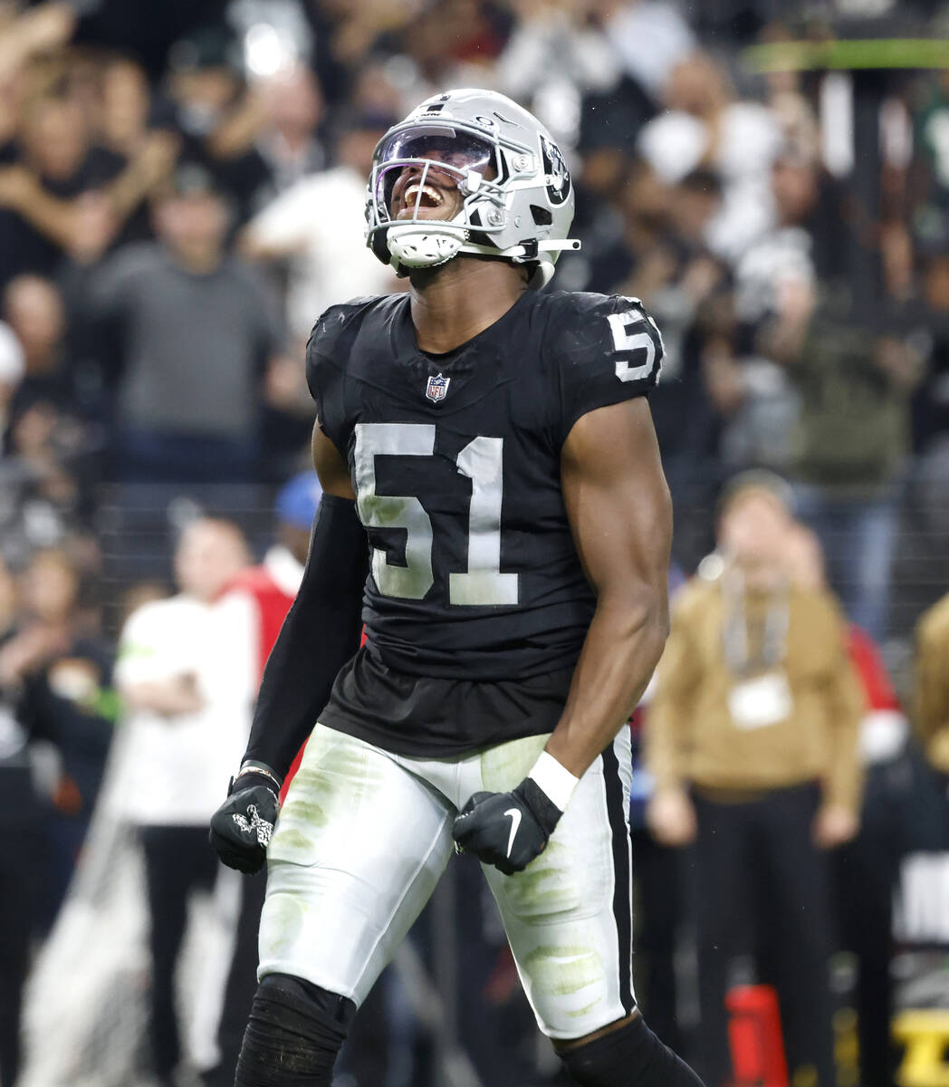 Raiders defensive end Malcolm Koonce (51) reacts after sacking New York Jets quarterback Zach W ...