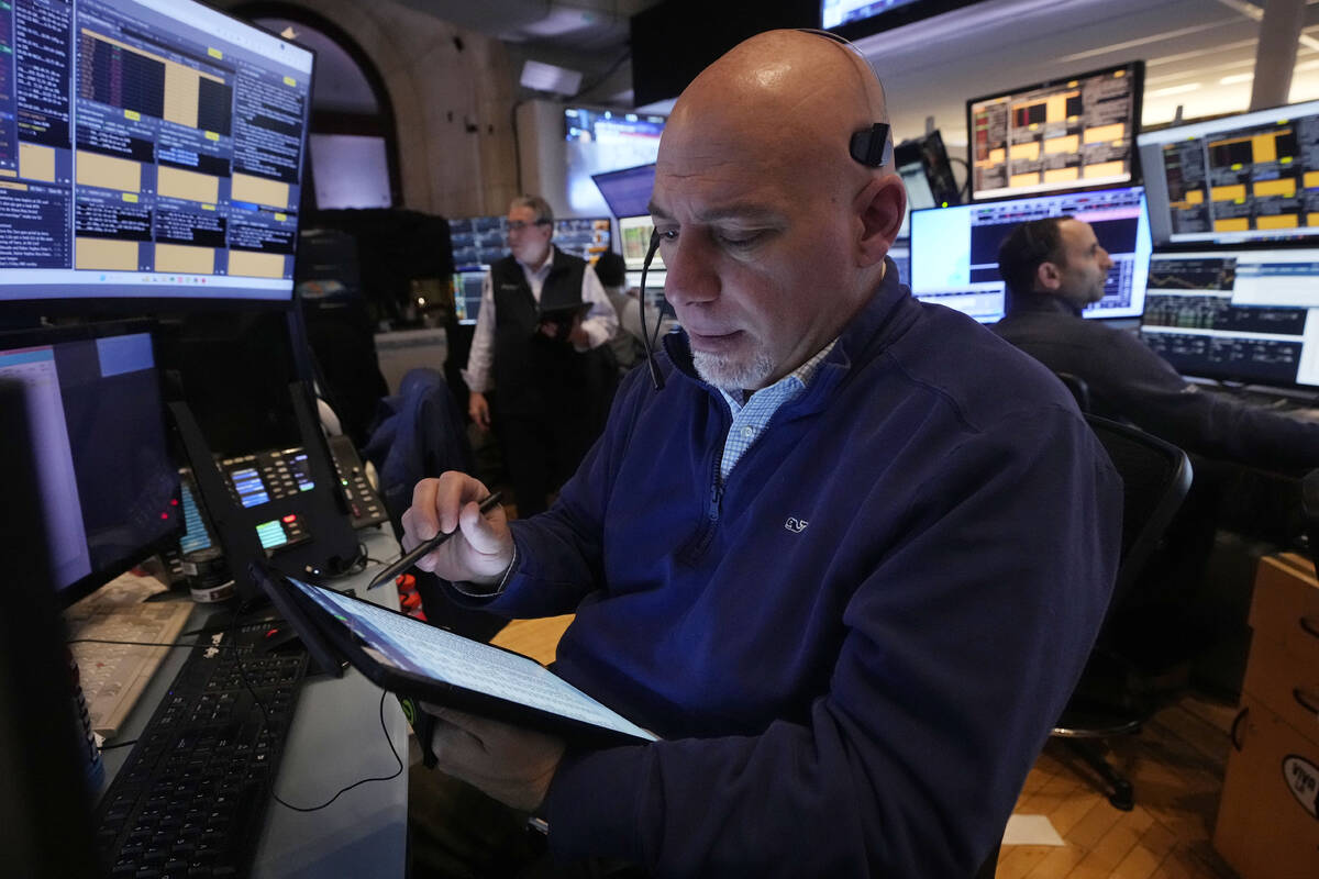 Trader Vincent Napolitano works on the floor of the New York Stock Exchange, Tuesday, March 11, ...