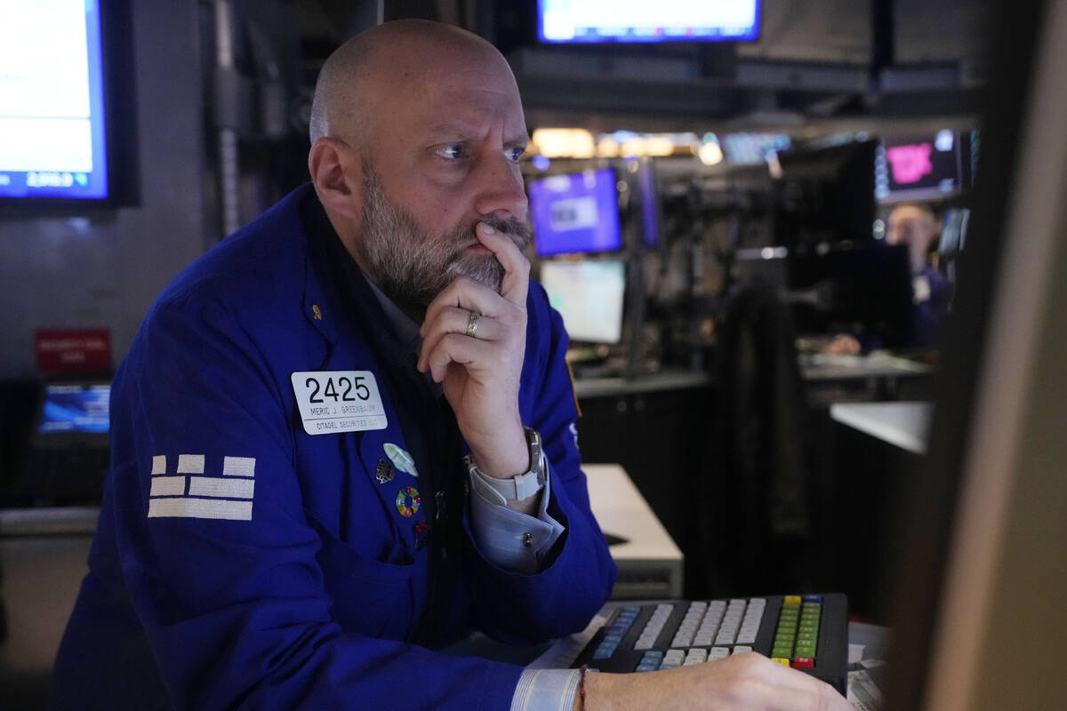 Specialist Meric Greenbaum works on the floor of the New York Stock Exchange, Tuesday, March 11 ...