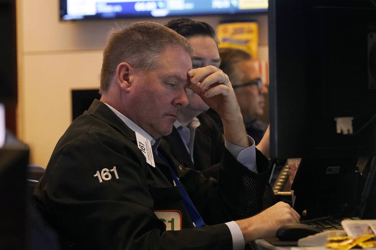 Traders work on the floor of the New York Stock Exchange, Tuesday, March 11, 2025. (AP Photo/Ri ...