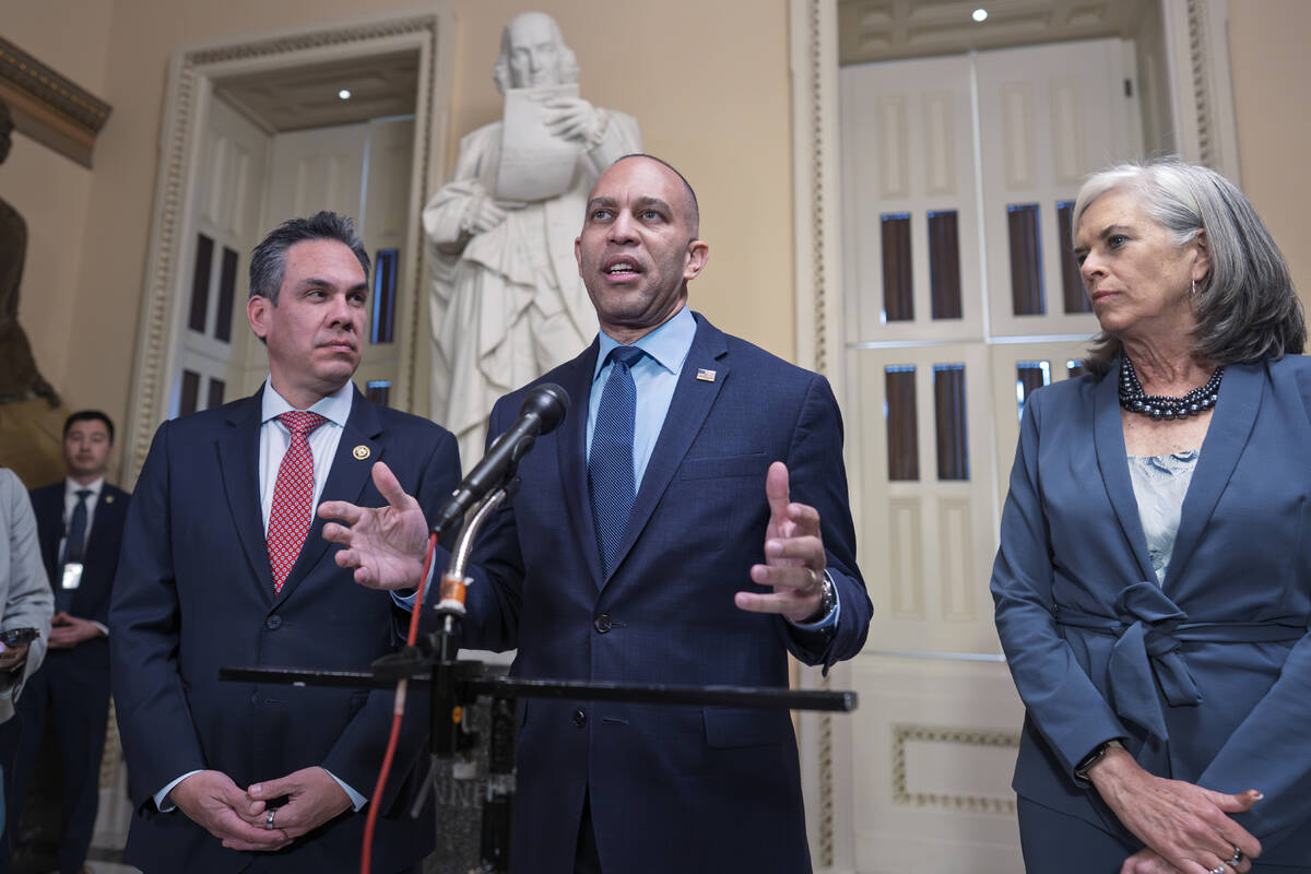 House Minority Leader Hakeem Jeffries, D-N.Y., center, flanked by Rep. Pete Aguilar, D-Calif., ...