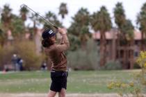 Sky Pointe's Drake Harvey watches his tee shot on the first hole during the NIAA Class 4A boys ...